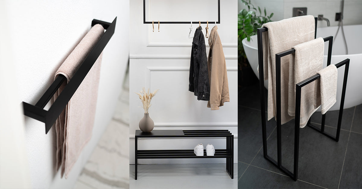 Minimalistische schwarze Stahlmöbel: Handtuchhalter CANNES an der Wand, Garderobenbank MILANO mit Jacken und Schuhen sowie freistehender Handtuchständer MONACO im Badezimmer – modernes, funktionales Interior Design