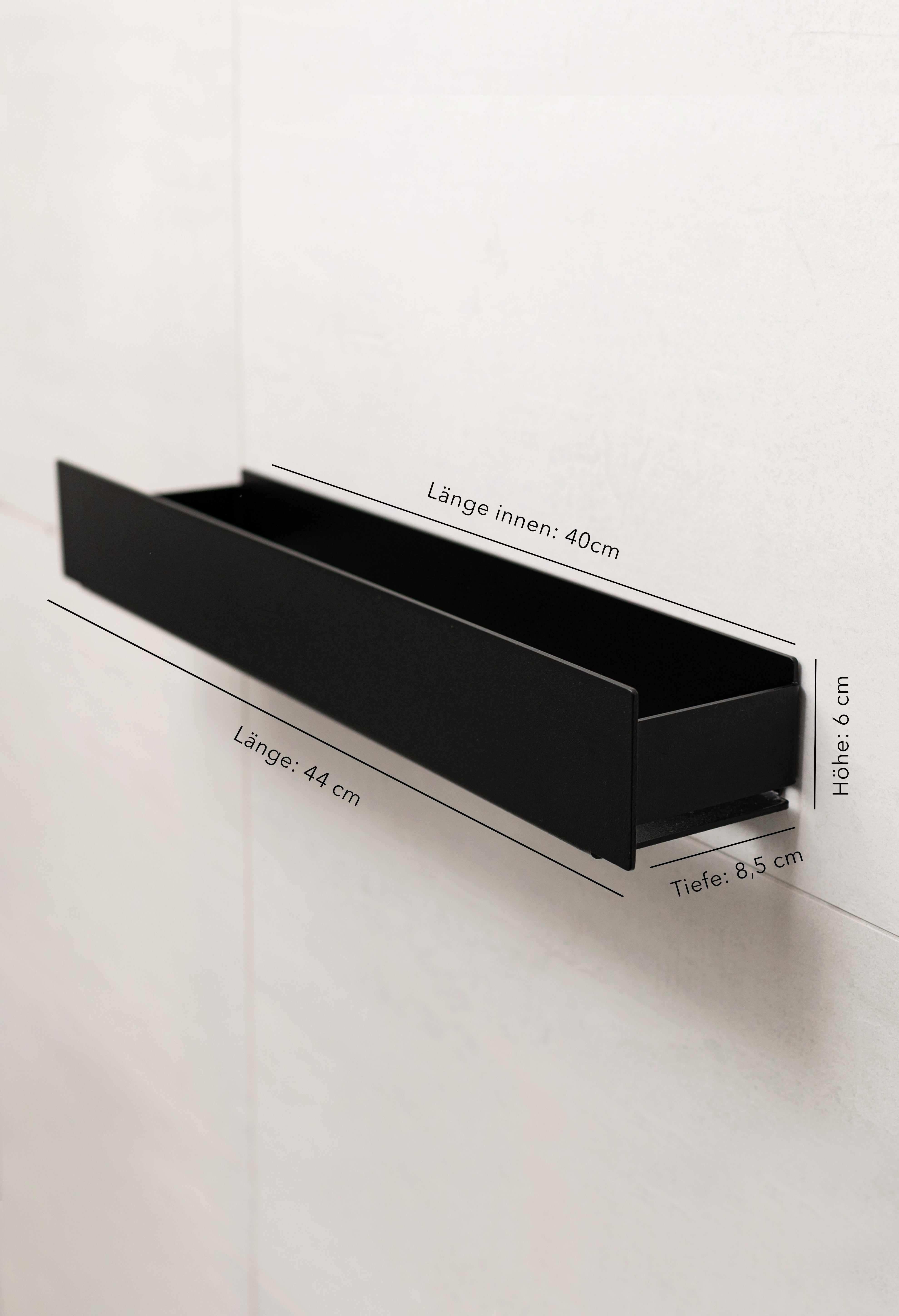 Duschablage Korsika zum Kleben in schwarz mit eingezeichneten Maßanagben.